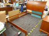QUEEN SIZE BED FRAME; MAHOGANY BED FRAME WITH A SLEIGH STYLE HEADBOARD. HAS WOODEN RAILS AND