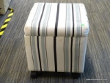 ROLLING STORAGE OTTOMAN; BLUE AND WHITE STRIPED OTTOMAN WITH A LIFT TOP THAT OPENS TO REVEAL