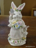 PORCELAIN RABBIT FIGURINE; SHOWS A MOTHER RABBIT WITH CHILDREN AND A BASKET FILLED WITH FLOWERS. IS