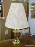 TABLE LAMP; BRASS LAMP WITH A CLOTH SHADE AND BRASS FINIAL. MEASURES 28 IN TALL