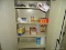 (HALL) CONTENTS OF CABINET TO INCLKUDE: PAPER TOWELS, A LARGE BOTTLE OF HAND SOAP, TRASH BAGS,