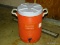 (HALL) ORANGE 5 GALLON WATER COOLER. USED.