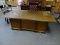 (RM8) VINTAGE WOODGRIN AND GLASS TOP OFFICE DESK. 7 DRAWERS. MEASURES 72