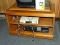 (RM8) WOODGRAIN ROLLING MICROWAVE/TV CART WITH LAZY SUSAN TOP AND 2 SHELF AREAS. MEASURES 30