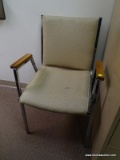 (RM4) VINTAGE METAL CHAIR. CREAM COLOR UPHOLSTREY.