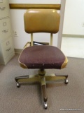 (RM7) VINTAGE METAL UPHOLSTERED ROLLING OFFICE CHAIR. SHOWS WEAR. N