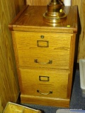 (RM8) OAK FINISHED TWO DRAWER LATERAL FILING CABINET WITH BRASS PULLS, LABEL PLATES & LOCKS.
