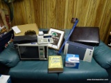 (RM8) CONTENTS ON TOP OF COUCH TO INCLUDE: BRIEFCASE (APPEARS TO BE NEW), TEXAS INSTRUMENTS TI-5045