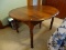 (KIT) ANTIQUE TABLE ; ANTIQUE WALNUT ROUND 42 IN SHERATON LEG TABLE WITH TWO LEAVES- FINISH ISSUE-42