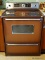 (KIT) STOVE ; GE ELECTRIC STOVE IN COPPER TONE COLOR - MODEL NUMBER 719002DC10 - 30 IN X 26 IN X 45