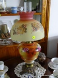 (LRM) VICTORIAN LAMP; ANTIQUE FLORAL PAINTED AND BRASS FOOTED OIL LAMP CONVERTED TO ELECTRIC WITH