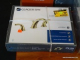 GLACIER BAY BATH FAUCET; #476 122 IN POLISHED BRASS. IS IN THE ORIGINAL BOX (HAS PLASTIC STRAPS