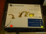 GLACIER BAY BATH FAUCET; #476 122 IN POLISHED BRASS. IS IN THE ORIGINAL BOX (HAS PLASTIC STRAPS