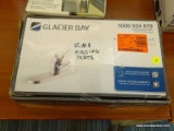 GLACIER BAY KITCHEN FAUCET; HAS A STAINLESS STEEL FINISH AND IS IN THE ORIGINAL BOX (HAS BEEN