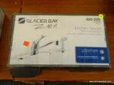 GLACIER BAY KITCHEN FAUCET WITH SIDE SPRAYER; MODEL 825 226 WITH A CHROME FINISH. IS IN THE ORIGINAL