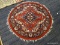 INDIA HERIZ RUG. MEASURES 4' DIAMETER.