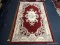 CHINA TUFTED RUG. MEASURES 5' X 7' 11