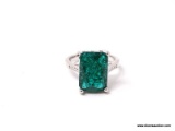 .925 STERLING SILVER LADIES 6 CT EMERALD RING. SIZE 8.