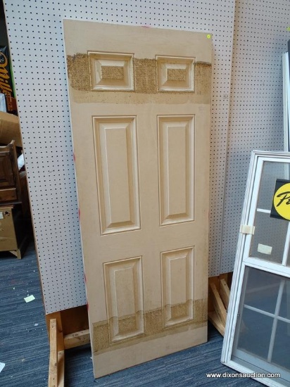 WOODEN PANELED DOOR