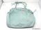 REBECCA MINKOFF MINT GREEN HAND BAG WITH METAL STUD DETAILING AND SIDE SNAPS. MEASURES APPROX. 14