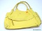 KATE SPADE YELLOW SOFT LEATHER HANDBAG WITH CENTER ZIPPER POCKET. MEASURES APPROX. 13