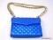 REBECCA MINKOFF BLUE QUILTED LEATHER PURSE. PURSE LOOKS LIKE IT WAS ORIGINALLY WHITE AND SOMEONE