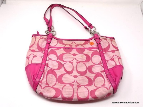 COACH PINK LOGO HOBO BAG WITH STUD DETAILING. MEASURES 15" X 11". SHOWS SIGNS OF WEAR.