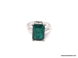 .925 STERLING SILVER LADIES 6 CT EMERALD RING. SIZE 8.