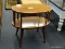 MID-CENTURY MODERN 2 TIER END TABLE WITH TURNED STYLE LEGS. MEASURES 23 IN X 13.5 IN X 21 IN. ITEM