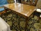 DINING TABLE WITH SQUARE PATTERN TOP AND STRAIGHT LEGS. MEASURES 41.5 IN X 65 IN X 29.5 IN. ITEM IS