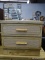 2 DRAWER LIGHT WOOD NIGHTSTAND WITH BAMBOO STYLE HANDLES. MEASURES 24 IN X 18 IN X 21 IN. RIGHT