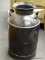 BLACK PAINTED DOUBLE HANDLED MILK JUG. MEASURES 14 IN X 23 IN. ITEM IS SOLD AS IS WHERE IS WITH NO