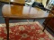 CHERRY DINING TABLE WITH SABRE LEGS AND BANDED TOP. MEASURES 36 IN X 60 IN X 30 IN. ITEM IS SOLD AS