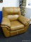 LEATHER RECLINER IN BROWN WITH OVERSTUFFED CUSHIONS. MEASURES 43 IN X 38 IN X 38 IN. HAS PICKING ON
