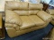 LEATHER 2 CUSHION LOVESEAT WITH OVERSTUFFED CUSHIONS. MEASURES 65 IN X 37 IN X 39 IN. HAS PICKING ON