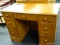 MAPLE DOUBLE PEDESTAL DESK WITH MAPLE KNOB STYLE PULLS. HAS 3 DRAWERS ON EITHER SIDE AND 1 CENTER