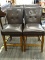 BLACK HIGH TOP CHAIRS WITH MAHOGANY LEGS. EACH MEASURES 18 IN X 22 IN X 39 IN. TOTAL OF 4. ITEM IS