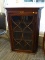 CORNER CABINET TOP WITH A SINGLE GLASS DOOR, 3 INTERIOR SHELVES, AND A MARQUETRY SHELL ACCENT ON THE