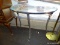 DEMI-LUNE GLASS TOP AND METAL BASE CONSOLE TABLE WITH SABRE STYLE LEGS. MEASURES 41 IN X 18 IN X 30