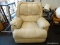 CREAM COLORED LEATHER OVERSTUFFED RECLINER. MEASURES 40 IN X 43 IN X 42 IN. SOLD AS IS, WHERE IS,