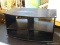 BLACK ROLLING ENTERTAINMENT STAND WITH 2 ADJUSTABLE SHELVES. MEASURES 40 IN X 23 IN X 23 IN. SOLD AS