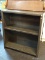 FOREST GREEN PAINTED BOOKCASE WITH 1 CENTER SHELF. MEASURES 32 IN X 13 IN X 35.5 IN. SOLD AS IS,