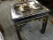 BLACK LACQUER AND GOLD PAINTED END TABLE WITH APPLIED GEISHA FIGURES IN A FAR EASTERN COUNTRYSIDE