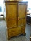 GENTLEMANS ARMOIRE WITH 2 UPPER SHELVES, A CENTER STORAGE AREA, 2 LOWER STORAGE CUBBY HOLES, AND 2