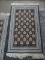 AREA RUG IN HUES OF BLUE, CREAM, AND PINK. MEASURES 2 FT X 3 FT 4 IN. SOLD AS IS, WHERE IS, WITH NO