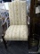 MARTHA WASHINGTON CHAIR WITH GREEN, CREAM, AND ORANGE UPHOLSTERY WITH MAHOGANY BONES AND BRASS