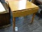 OAK DROPSIDE TABLE WITH TURNED LEGS. WITH SIDES DOWN MEASURES 25 IN X 29 IN X 30 IN. WITH SIDES UP