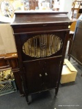 BRUNSWICK MAHOGANY MUSIC CABINET WITH A LIFT TOP, CENTER HORN, AND 2 LOWER DOORS THAT OPEN TO REVEAL