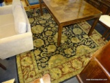 8 FT X 11 FT AREA RUG IN RED, GOLD, AND BLACK FLORAL PATTERN. ITEM IS SOLD AS IS WHERE IS WITH NO