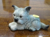 GOEBEL FIGURINE OF A DOG LAYING DOWN. #30 118. MEASURES 4 IN X 3 IN. ITEM IS SOLD AS IS WHERE IS